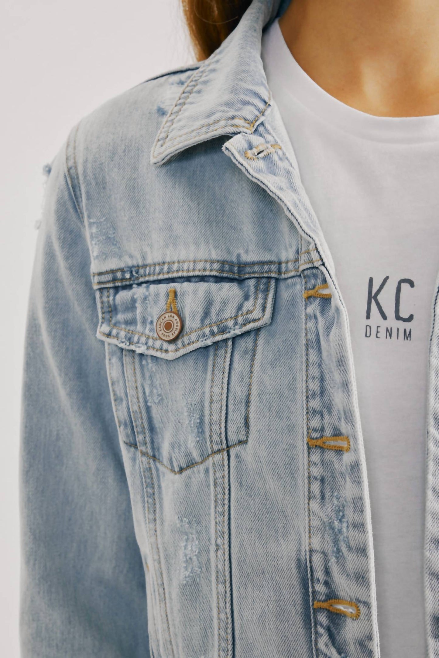 Distressed Denim Jacket In Light